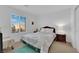 Bright bedroom with a cozy bed, bedside table, and a window offering natural light at 1909 Pinsky Ln, North Las Vegas, NV 89032