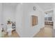 Hallway with neutral paint and tile flooring, leading to a bathroom and bedroom at 1909 Pinsky Ln, North Las Vegas, NV 89032
