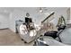 Spacious living room with stairs, a ceiling fan, and lots of natural light at 1909 Pinsky Ln, North Las Vegas, NV 89032