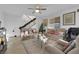 Comfortable living room with ceiling fan and lots of natural light at 1909 Pinsky Ln, North Las Vegas, NV 89032