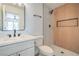 Modern bathroom with a stand-up shower featuring wood paneling and stylish fixtures at 1945 Margarita Ave, Henderson, NV 89011