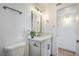 This bathroom features a modern vanity with white countertop, black fixtures, and designer mirror at 1945 Margarita Ave, Henderson, NV 89011