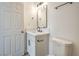 This bathroom features a modern vanity with white countertop and sleek black fixtures at 1945 Margarita Ave, Henderson, NV 89011