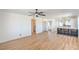 Open living space showcasing wood floors, bar seating, and modern ceiling fan at 1945 Margarita Ave, Henderson, NV 89011