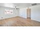 Large living room displaying laminate flooring, a ceiling fan, and a bright window at 1945 Margarita Ave, Henderson, NV 89011