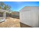 A well-maintained shed sits in a spacious backyard with a covered patio, perfect for storage at 1945 Margarita Ave, Henderson, NV 89011