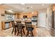Spacious kitchen with stainless steel appliances, granite countertops, and a large island with bar seating at 2021 Evansdale St, Henderson, NV 89052