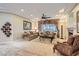 Elegant living room featuring recessed lighting, a cozy fireplace, and neutral-toned furnishings at 2021 Evansdale St, Henderson, NV 89052