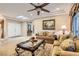 Spacious living area with a cozy seating arrangement, recessed lighting, and a view of the entryway at 2021 Evansdale St, Henderson, NV 89052