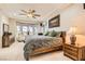 Cozy main bedroom with a ceiling fan, bay window, and comfortable furnishings at 2021 Evansdale St, Henderson, NV 89052