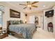Comfortable main bedroom boasts a ceiling fan, recessed lighting, and adjoining bath and closet access at 2021 Evansdale St, Henderson, NV 89052