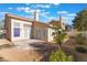 Backyard featuring a covered patio, desert landscaping, and privacy fencing at 2124 Brighton Shore St, Las Vegas, NV 89128