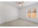 An empty bedroom has carpet, a ceiling fan, and a window with blinds at 2124 Brighton Shore St, Las Vegas, NV 89128
