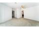A bedroom with neutral carpet with white walls includes an entry to a bathroom and closet at 2124 Brighton Shore St, Las Vegas, NV 89128