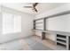 Bedroom with built in shelving and cabinets along one wall next to a window at 2124 Brighton Shore St, Las Vegas, NV 89128