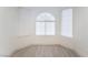 A dining nook featuring tile floors and an arched window with an abundance of natural light at 2124 Brighton Shore St, Las Vegas, NV 89128