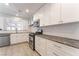 A modern kitchen featuring white cabinets, stainless steel appliances, and gray countertops at 2124 Brighton Shore St, Las Vegas, NV 89128