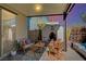 Covered backyard patio featuring a cozy fireplace and outdoor seating at 2132 Ponticino St, Henderson, NV 89044
