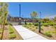 Inviting community pool area with lounge chairs and umbrellas, perfect for relaxing on sunny days at 2132 Ponticino St, Henderson, NV 89044