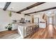 Bright kitchen features stainless steel appliances, modern island, and stylish tile backsplash at 2132 Ponticino St, Henderson, NV 89044