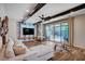 The living room is spacious with large glass doors that flow to the outdoor living and pool at 2132 Ponticino St, Henderson, NV 89044