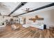 Spacious living room with an open floor plan that connects to a modern kitchen at 2132 Ponticino St, Henderson, NV 89044