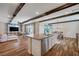 Open concept kitchen and living room with modern appliances and sliding glass door at 2132 Ponticino St, Henderson, NV 89044