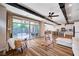 Open-concept living room flows into a stylish kitchen and has large sliding doors to the pool at 2132 Ponticino St, Henderson, NV 89044