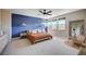 Serene main bedroom features accent wall, natural light, and stylish furnishings at 2132 Ponticino St, Henderson, NV 89044