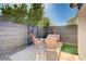 This serene patio is perfect for outdoor gatherings with stylish seating and a lush green backdrop at 2132 Ponticino St, Henderson, NV 89044