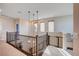 Second floor hallway with lots of natural light and security gate at 2132 Ponticino St, Henderson, NV 89044