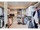 Spacious walk-in closet with extensive shelving and hanging space for optimal organization and storage at 2132 Ponticino St, Henderson, NV 89044