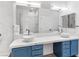 Bathroom boasts dual vessel sinks, undermount storage and mirrors, with bright and luxurious shower at 2325 Windmill Pkwy # 1711, Henderson, NV 89074