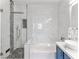 Luxurious bathroom featuring marble tile, a walk-in shower, and a stylish vessel sink vanity at 2325 Windmill Pkwy # 1711, Henderson, NV 89074