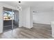 Bright dining area boasts sleek wood floors, modern lighting, and sliding glass doors to a patio at 2325 Windmill Pkwy # 1711, Henderson, NV 89074