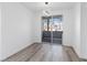 Bright dining room featuring wood floors, modern lighting, and sliding glass doors to a balcony at 2325 Windmill Pkwy # 1711, Henderson, NV 89074