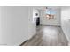 Living room with gray wood flooring, fireplace, and a large window, offering a modern and inviting space at 2325 Windmill Pkwy # 1711, Henderson, NV 89074