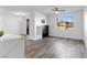 Bright living room featuring gray wood flooring, modern fireplace, and a large window for ample natural light and neighborhood views at 2325 Windmill Pkwy # 1711, Henderson, NV 89074