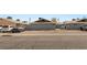 View of the street in front of the apartments and the assigned parking spaces at 2426 Statz St, North Las Vegas, NV 89030