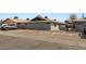 Exterior side view of apartments with assigned visitor and resident parking at 2426 Statz St, North Las Vegas, NV 89030