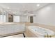 Bathroom featuring tub, double sinks, ample counter space, and modern design at 2877 Paradise Rd # 2203, Las Vegas, NV 89109