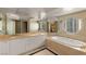Bathroom featuring tub, double sinks, ample counter space, and natural light at 2877 Paradise Rd # 2203, Las Vegas, NV 89109