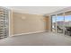 Comfortable bedroom with access to balcony providing panoramic views of the surrounding city at 2877 Paradise Rd # 2203, Las Vegas, NV 89109