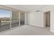 Serene bedroom with balcony access offering stunning views of the cityscape and mountains at 2877 Paradise Rd # 2203, Las Vegas, NV 89109