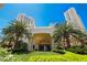 Lush landscaping, mature palm trees and meticulously manicured lawns frame the building's entrance at 2877 Paradise Rd # 2203, Las Vegas, NV 89109