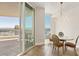 Bright dining area with balcony access and city skyline views at 2877 Paradise Rd # 2203, Las Vegas, NV 89109