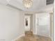Elegant condo hallway with tile flooring, designer lighting, and access to multiple rooms at 2877 Paradise Rd # 2203, Las Vegas, NV 89109