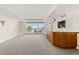 Spacious living room featuring a built-in bar, balcony access, and city views at 2877 Paradise Rd # 2203, Las Vegas, NV 89109