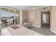 Bright main bedroom featuring a private balcony with city views, carpeting throughout, and neutral tones to enhance the space at 2877 Paradise Rd # 2203, Las Vegas, NV 89109