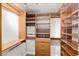 Spacious walk-in closet with built-in shelving and cabinets for ample storage at 2877 Paradise Rd # 2203, Las Vegas, NV 89109